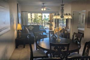 a dining room and living room with a table and chairs at Princesa de Penasco B208 - Family Beach Getaway in Puerto Peñasco