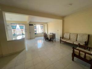 a living room with a couch and a table at Maria's Place in Quillacollo