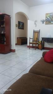 a living room with a couch and a mirror at Las Colinas in León