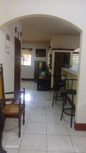 a living room with a table and some chairs at Las Colinas in León +11 photos