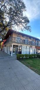 a building with a balcony on the side of it at Del Centro Dptos in Federación