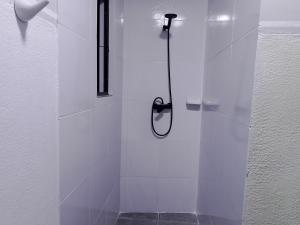 a shower with a glass door in a bathroom at Casa Sajama 121 in La Paz +81 photos