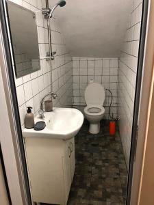 a small bathroom with a toilet and a sink at Single Bed Center in Plovdiv +19 photos
