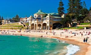 a group of people on a beach in front of a building at Private sanctuary between river and sea in Perth