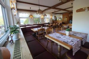 an overhead view of a restaurant with tables and chairs at Hotel SchwarzaBurg in Schwarzburg