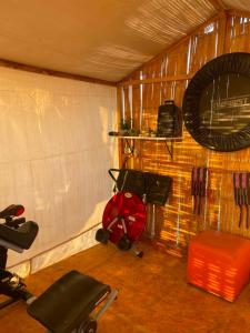 a room with a room with a chair and a mirror at La Bahia de Makale in Pisco +23 photos