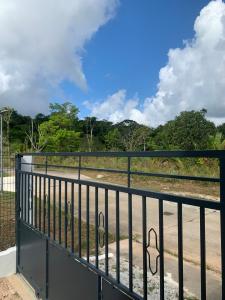 a balcony with a fence and a road at Appartement t2 in Matoury