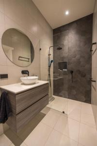 a bathroom with a sink and a shower at Gosford Retreat in Gosford