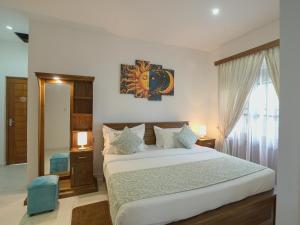 a bedroom with a large bed and a window at Kandy 888 Villa in Kandy