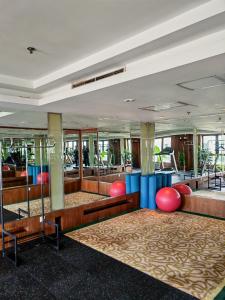 a lobby with red and blue chairs and tables at Guo Ji Yi Yuan Hotel in Beijing