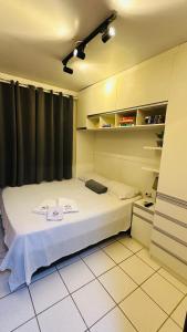 a small bedroom with a bed in a room at 118-Flat Completo Fechadura Eletrônica Próx Aeroporto in São Luís +32 photos