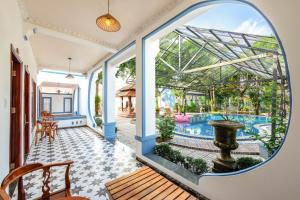 a view of the pool from the living room of a house at Trương Nhi Bungalow in Phú Quốc