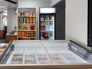 an empty counter in a kitchen with a refrigerator at Paradise Island Resort in Gold Coast