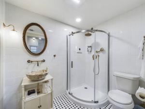 a bathroom with a shower and a toilet and a sink at Buchanan Bungalow - Eclectic Mid-Mod Design DT in Lafayette