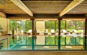 a house with a pool in the middle of it at Hotel Krainerhütte in Baden