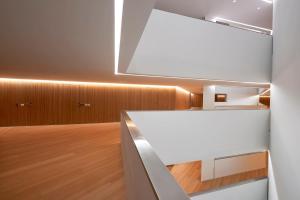 a kitchen with a white counter and wood floors at Meliá Palma Bay in Palma de Mallorca