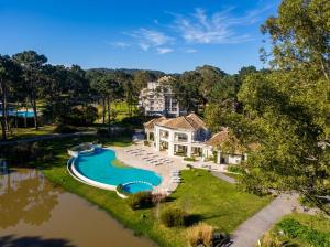 an aerial view of a house with a swimming pool at Green Park Departamentos Exclusivos in Punta del Este