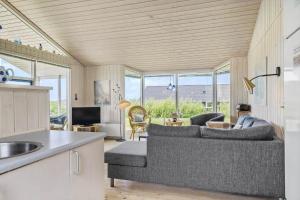 a living room with a couch and a table at G112-Lemvig-Anemonevej-12 in Lemvig