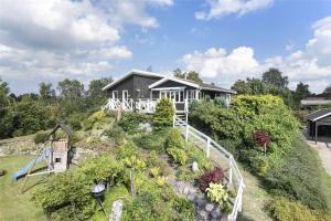 a house on top of a hill with a garden at 13383-Asnaes-Glentevej-15 in Asnæs