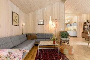 a living room with a couch and a table at 10039-Nykobing-Sj-Rishoj-Sidevej-9 in Nakke
