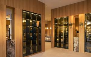 a store with glass doors in a building at Meliá Durres Albania in Draç +87 photos