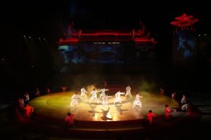 a group of people dancing on a round stage at Castfast Hotel in Dongguan