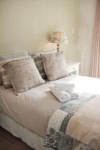 Ένα ή περισσότερα κρεβάτια σε δωμάτιο στο Olive Manor Guest House