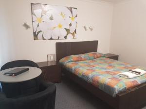 Postel nebo postele na pokoji v ubytování Carnarvon Gateway Motel