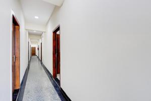 a corridor of an empty room with two doors at Collection O Sadar Bazar Gurgaon in Gurgaon