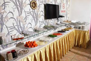 a buffet line with many different types of food at Talaslioglu Hotel in Kayseri