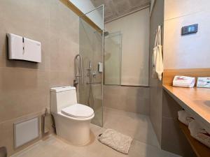 a bathroom with a toilet and a glass shower at Hotel Casona Solar in Arequipa +92 photos