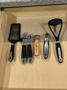 a group of kitchen utensils sitting on top of a drawer at Studio - NYC, Greenwich, Capitol, Parking in Port Chester