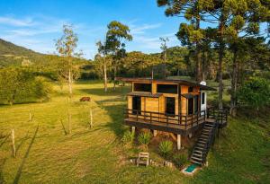 an overhead view of a tree house in a field at Pé na Picada in Urubici +9 photos