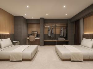 a bedroom with two beds and a desk at KABIN Shiro - Regale Collection in Osaka +11 photos