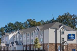 a rendering of the exterior of a mgm hotel at Microtel Inn & Suites by Wyndham Macon in Wesleyan Hills