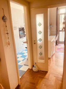 a room with a kitchen with a door and a floor at Lungomare Crotone in Crotone +19 photos