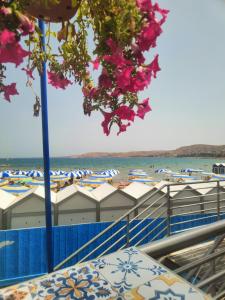 a view of a beach with umbrellas and the ocean at Lungomare Crotone in Crotone