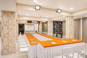 a large conference room with a long table and chairs at Hotel Eagle Empire in Madgaon +52 photos