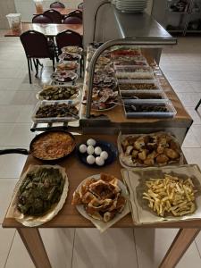 a buffet line with many different types of food at Grand Aral Otel in Aratol