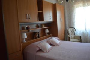 a bedroom with a bed with two towels on it at Casa Vacanza La Zanca in Zanca