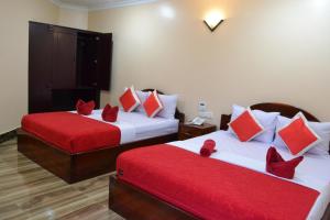 Postel nebo postele na pokoji v ubytování Capital Battambang Hotel