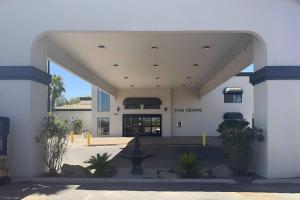 an entrance to a building with a fountain in the courtyard at Quality Inn Casa Grande I-10 in Casa Grande