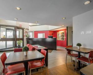 a restaurant with tables and chairs in a room at Comfort Inn Prince Albert in Prince Albert
