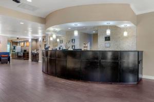 a hotel lobby with a reception desk in the middle at Comfort Suites near MCAS Beaufort in Beaufort +52 photos