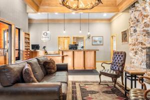 a living room with a couch and a kitchen at Quality Inn Rock Springs - Green River in Rock Springs