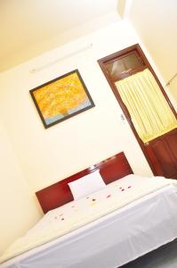 Postel nebo postele na pokoji v ubytování Mango Garden Hoi An Homestay
