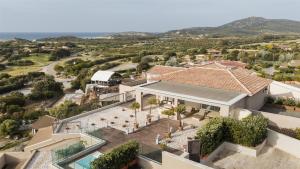an aerial view of a villa with a swimming pool at Conrad Chia Laguna Sardinia in Chia