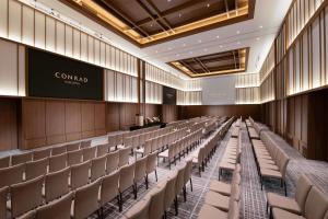 an empty lecture hall with chairs and a screen at Conrad Nagoya in Nagoya +77 photos