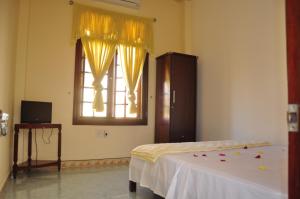 Postel nebo postele na pokoji v ubytování Mango Garden Hoi An Homestay