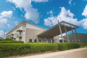 a large building with a roof on the side of it at MainStay Suites Whyalla in Whyalla